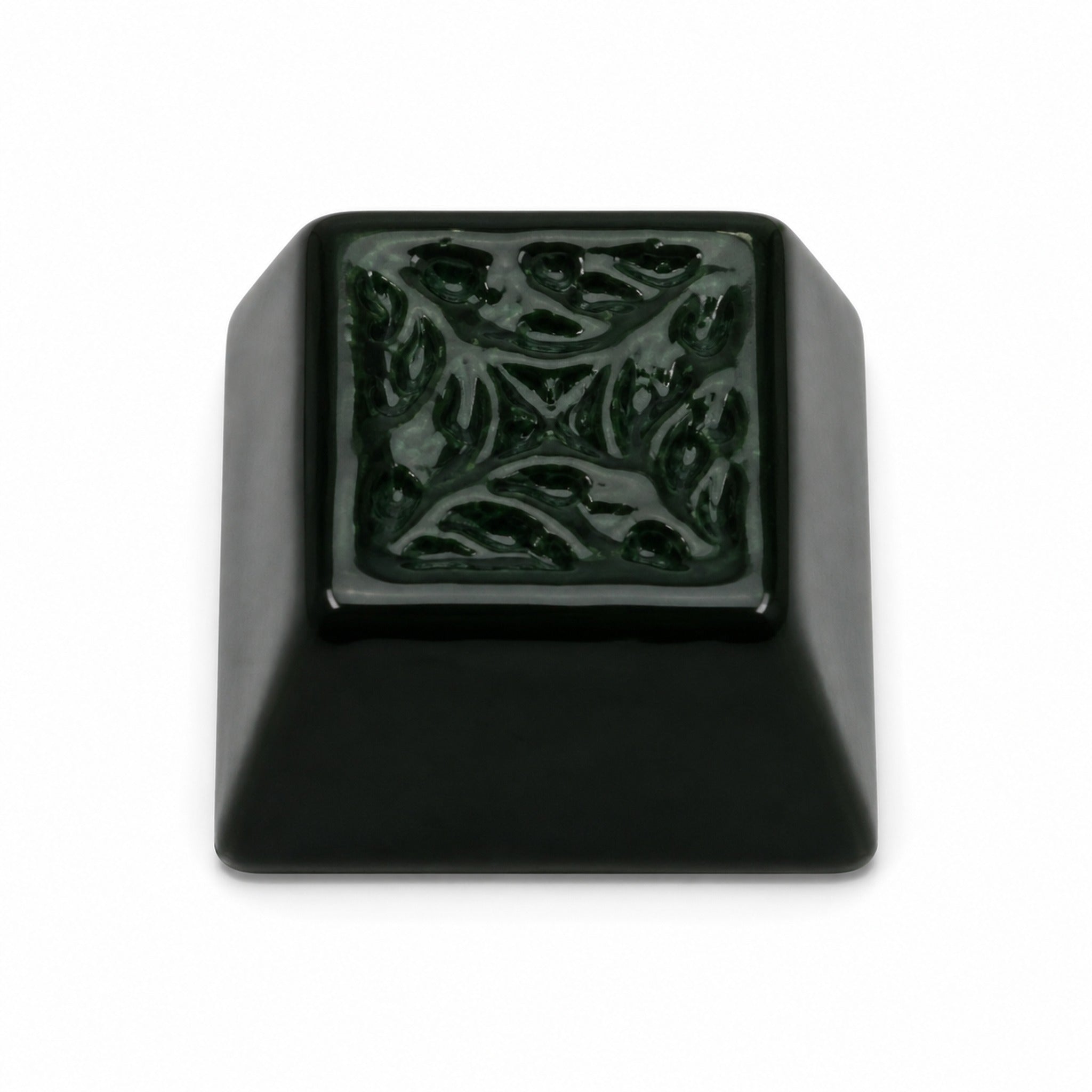 Deep emerald ceramic keycap on pure white background
