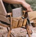 Setstead Camp Chair Side Pocket attached to a camp chair holding a notebook, bottle, and sunglasses
